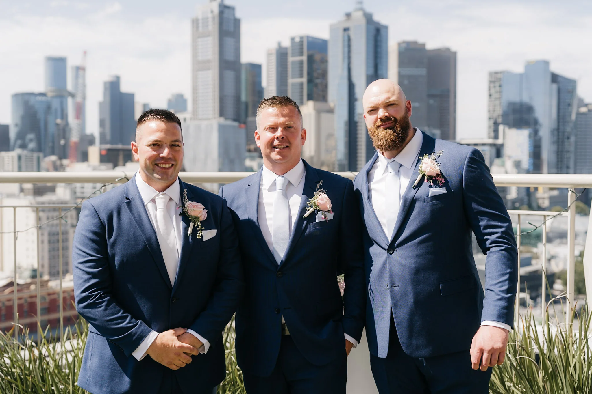 Rob and his groomsmen with Melbourne's skyline behind them
