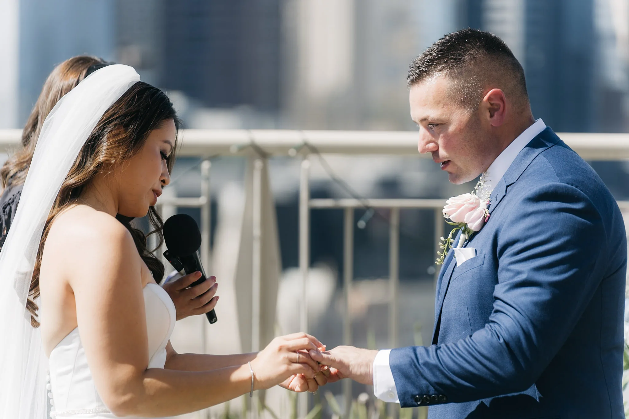 Che placing Rob's wedding ring on his hand