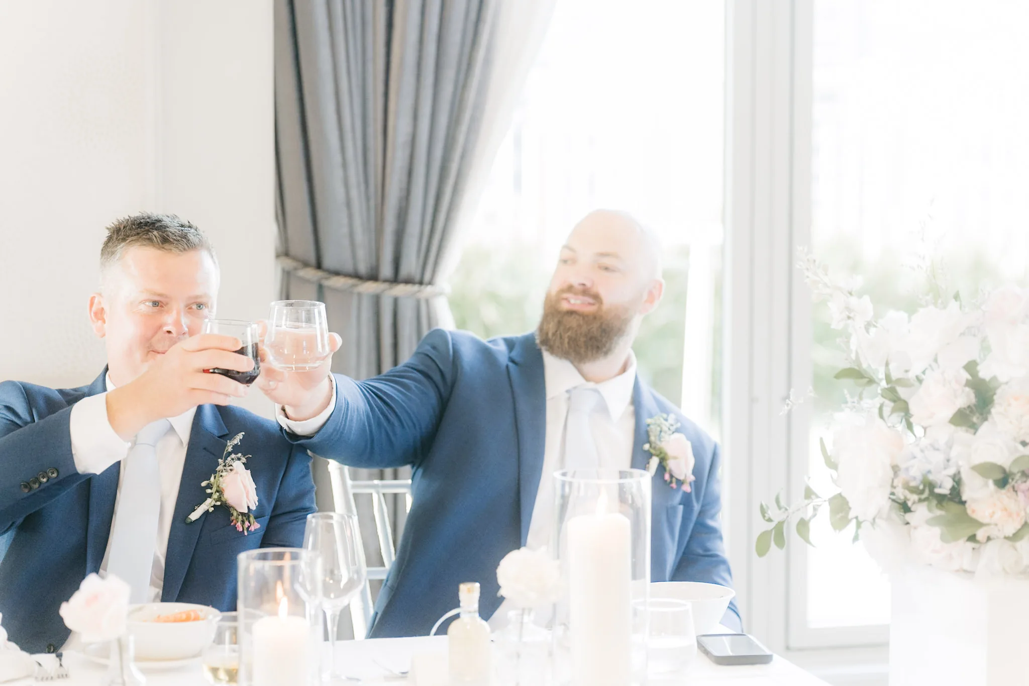 A playful toast between Rob and his groomsmen