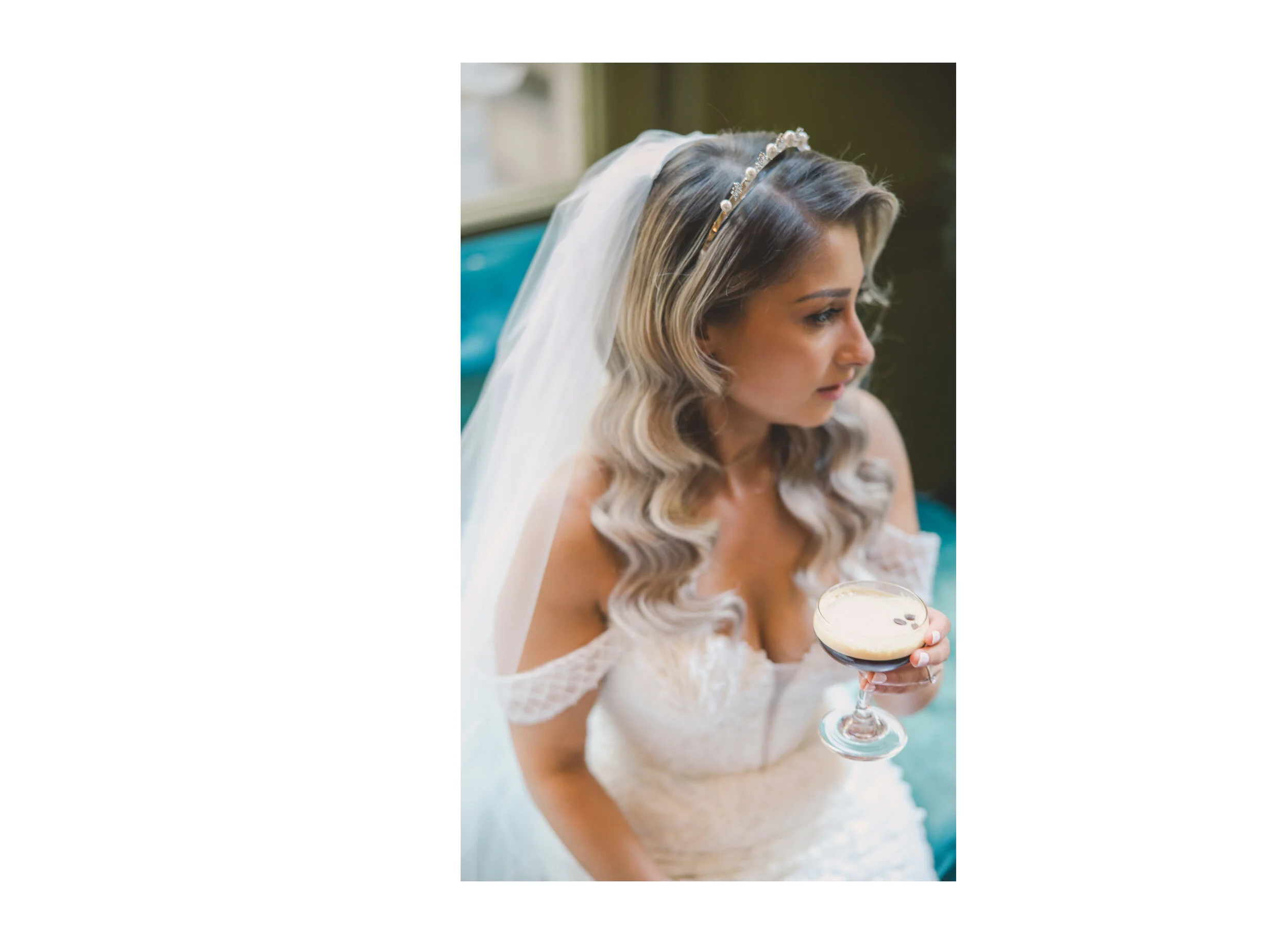 Bride holding an espresso martini during wedding preparations