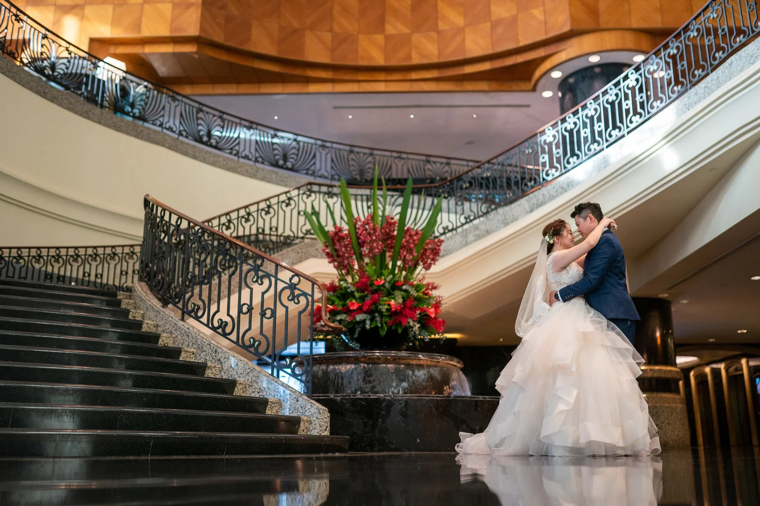 Wedding portrait on a sweeping atrium staircase