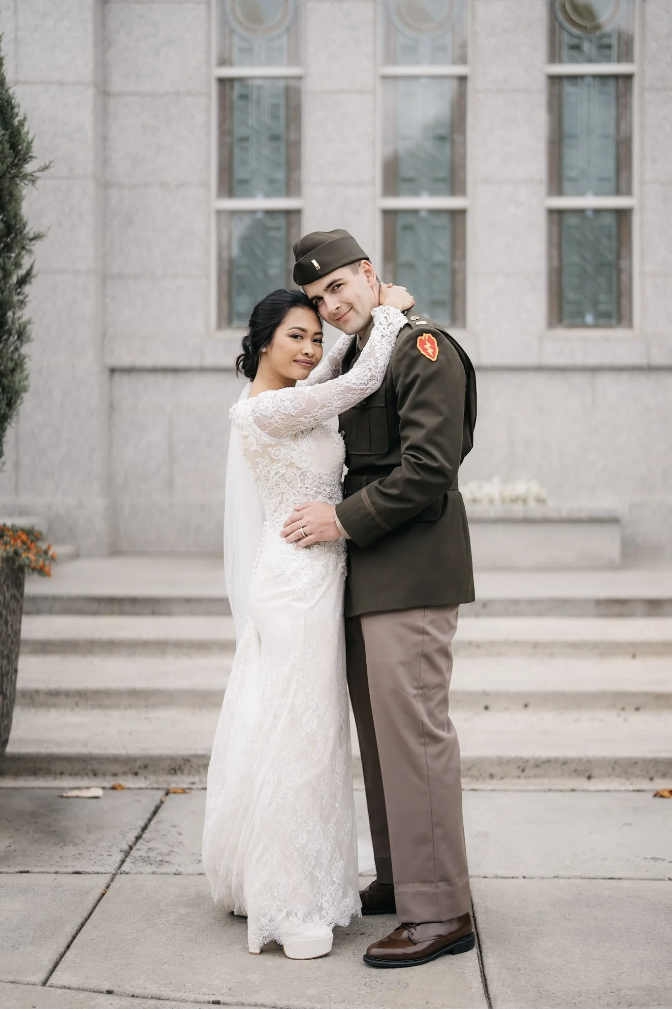Couple embracing on broad city steps