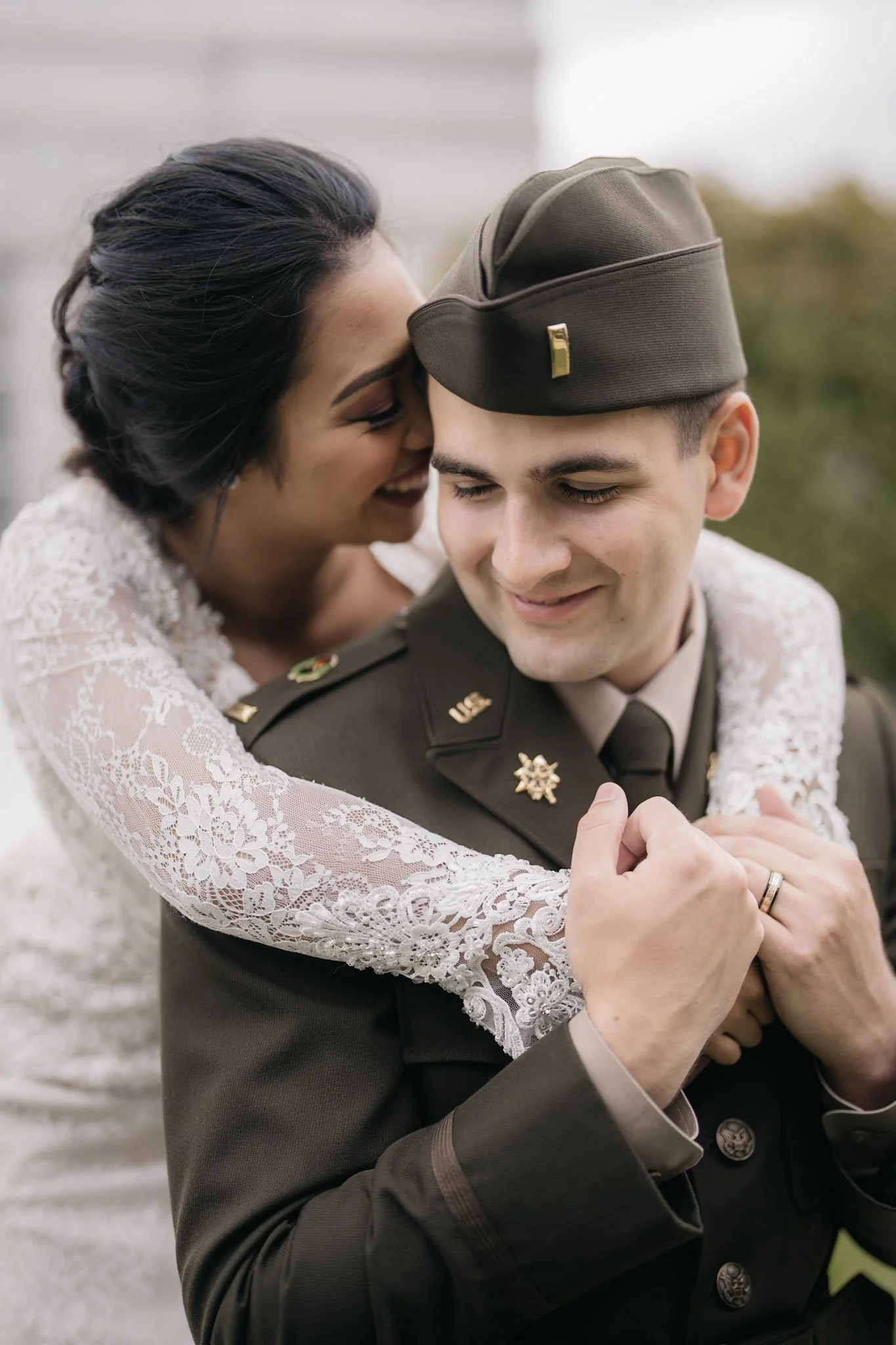 A warm close portrait of newlyweds laughing