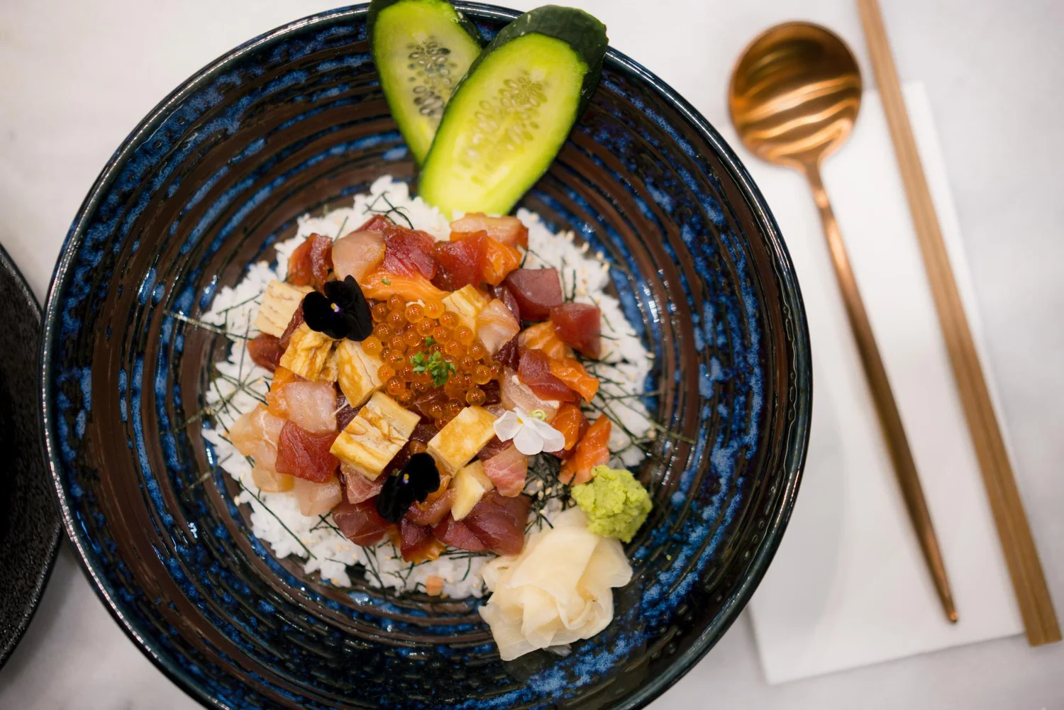 Colourful Calia rice bowl photographed from above on a marble table