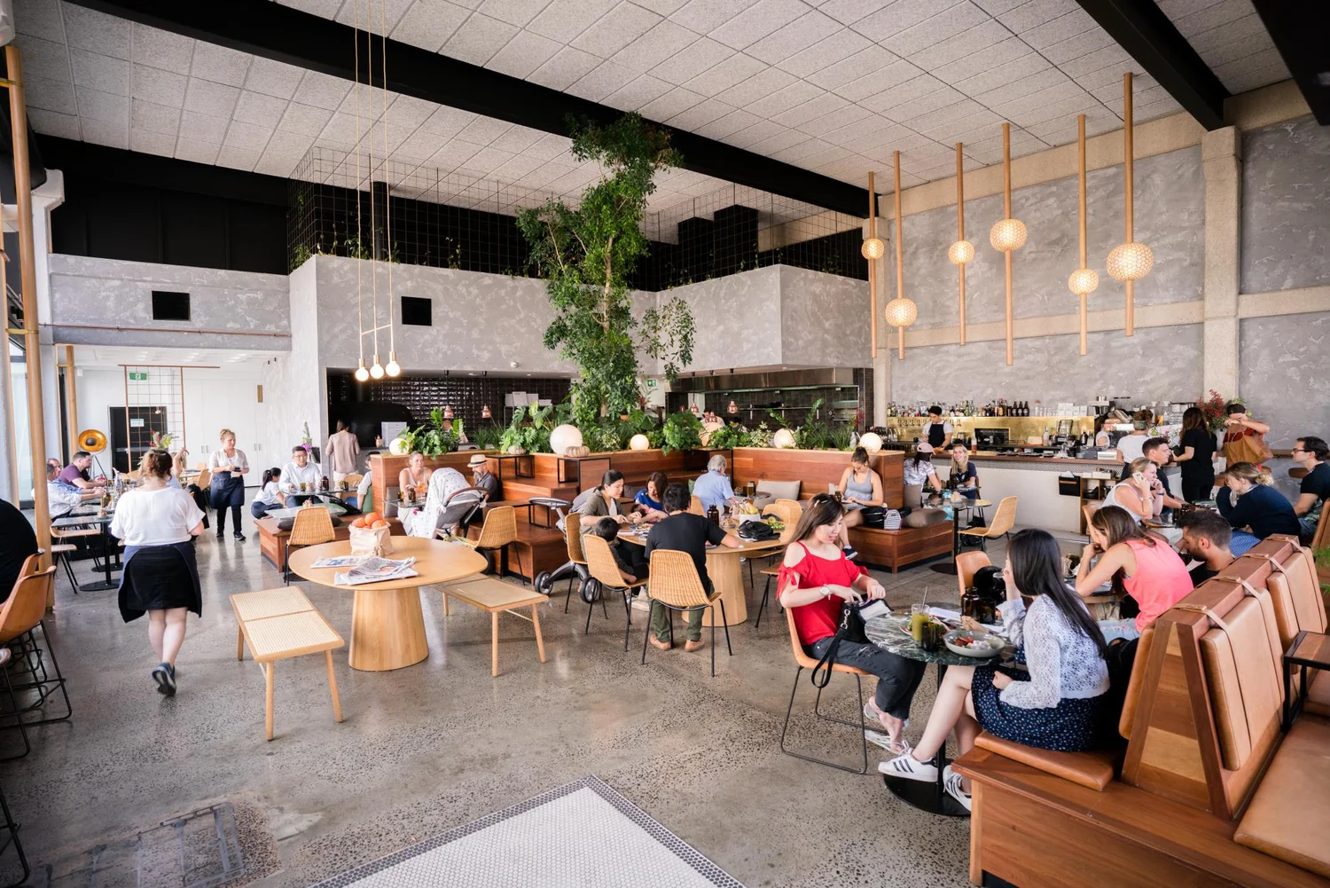 Wide interior of the Abacus dining room filled with guests