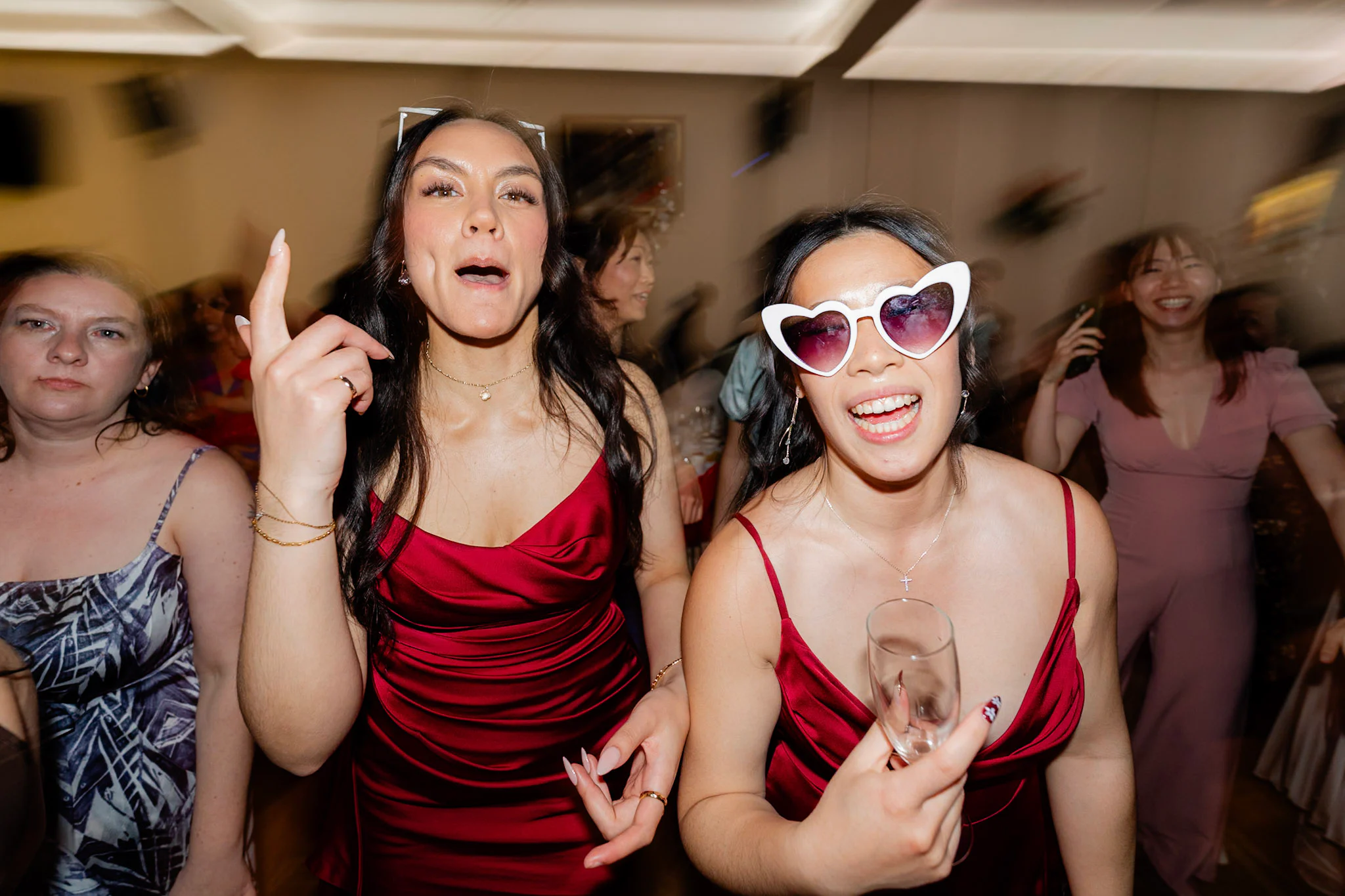 Wedding guests singing and dancing together
