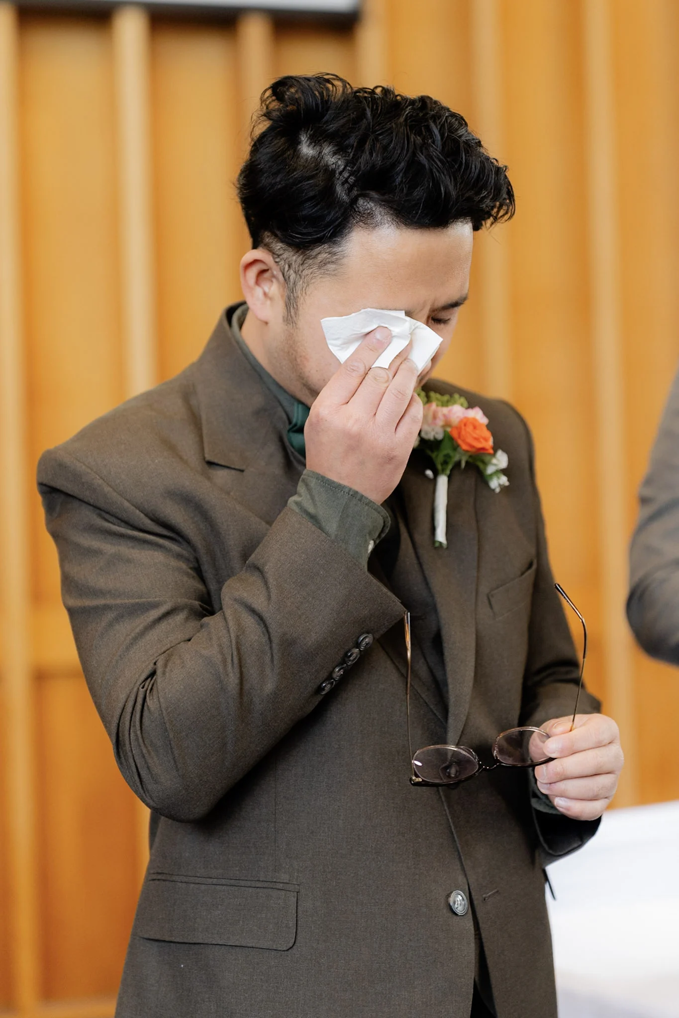 Ron wiping away a tear as he sees Joy approach