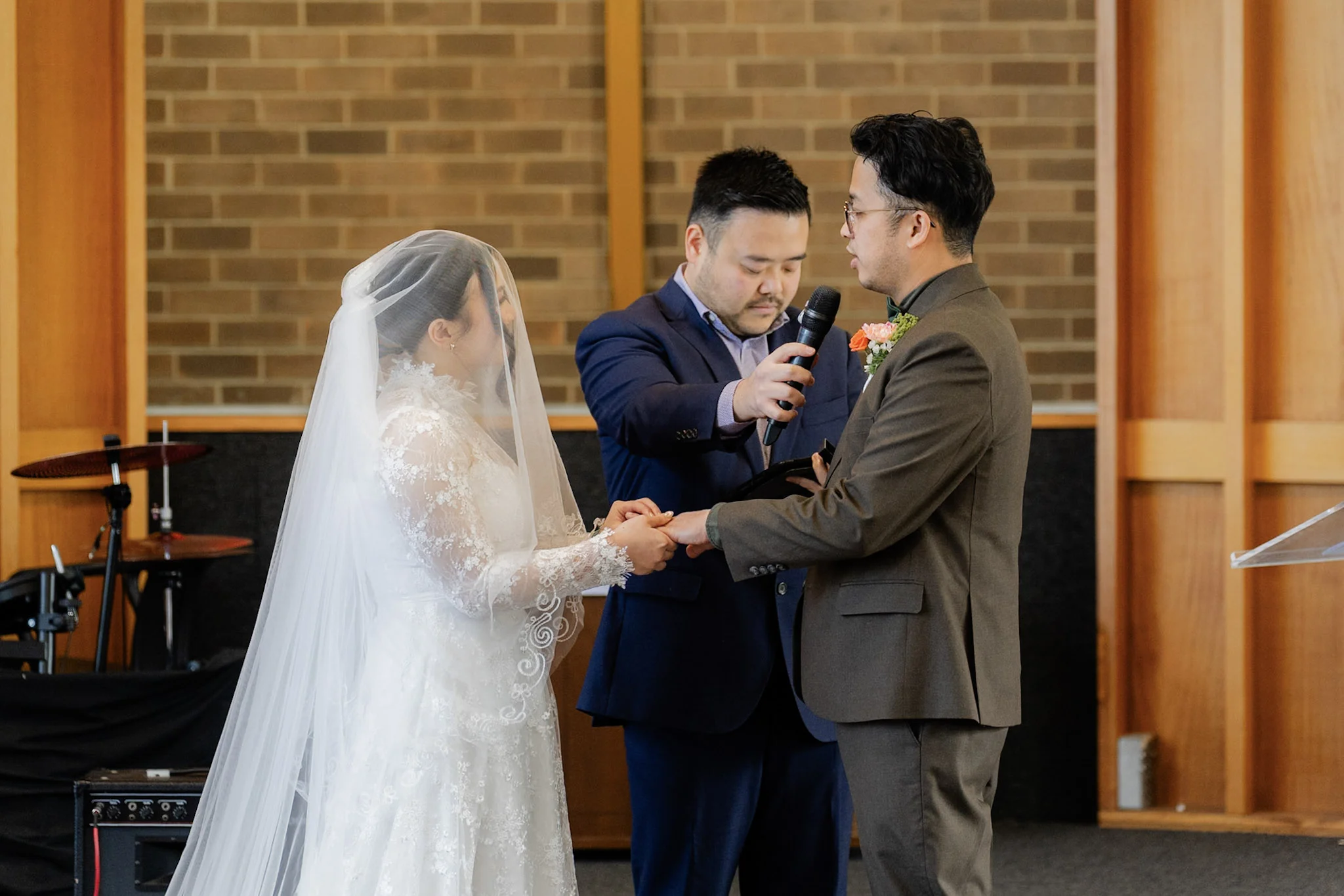 Ron and Joy exchanging rings before their families and friends