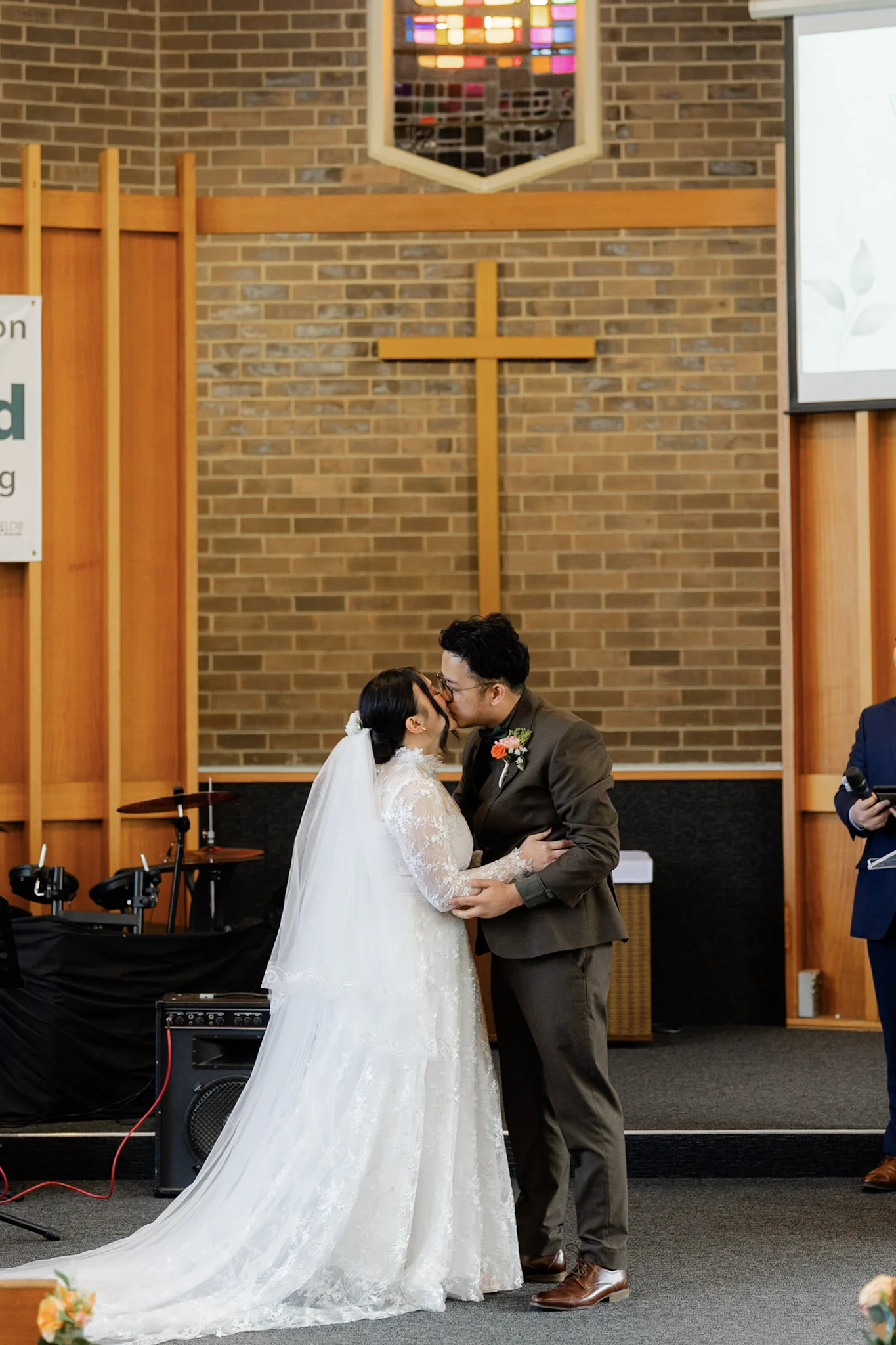Ron and Joy sharing their first kiss at the altar