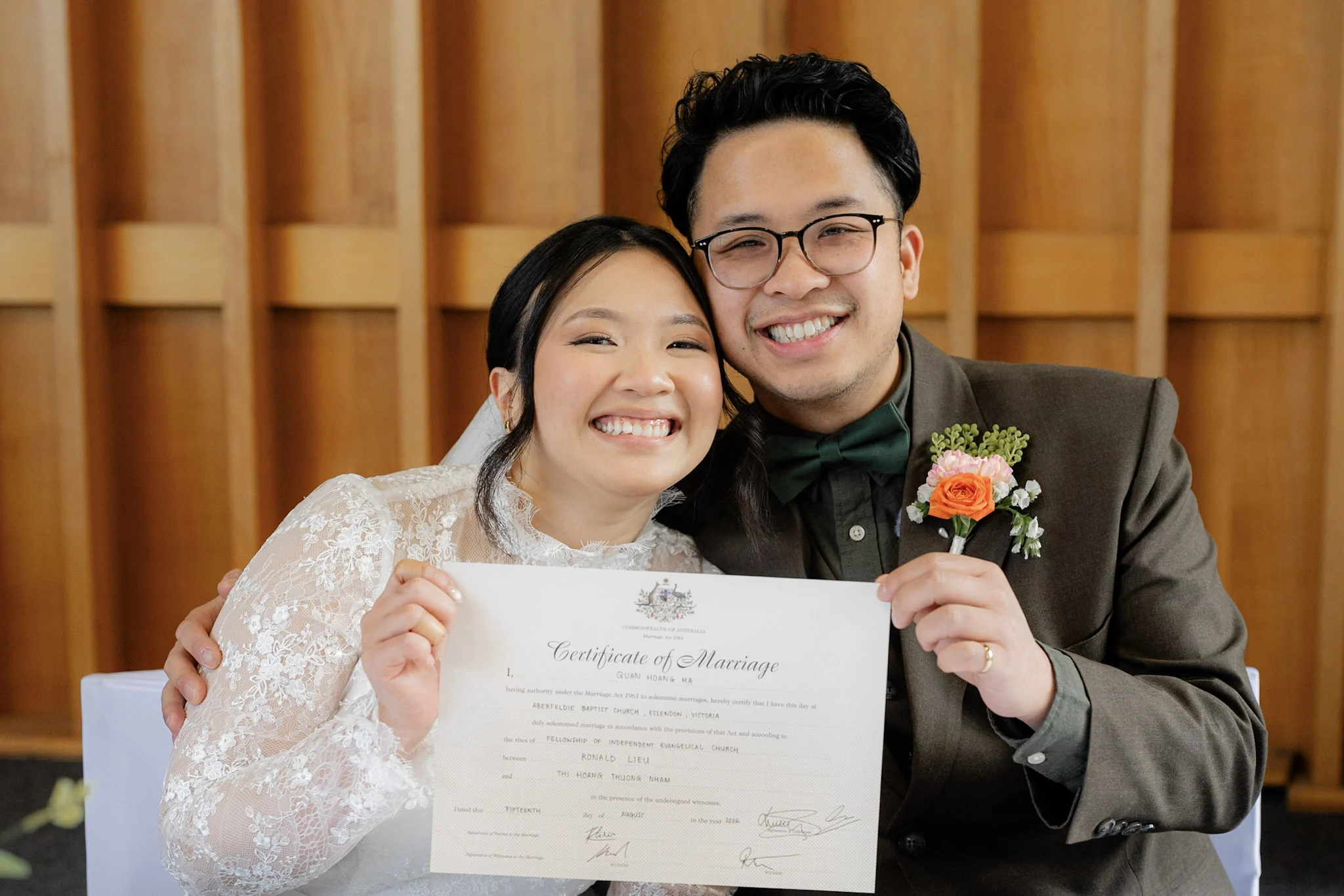 Ron and Joy smiling together after signing their marriage certificate