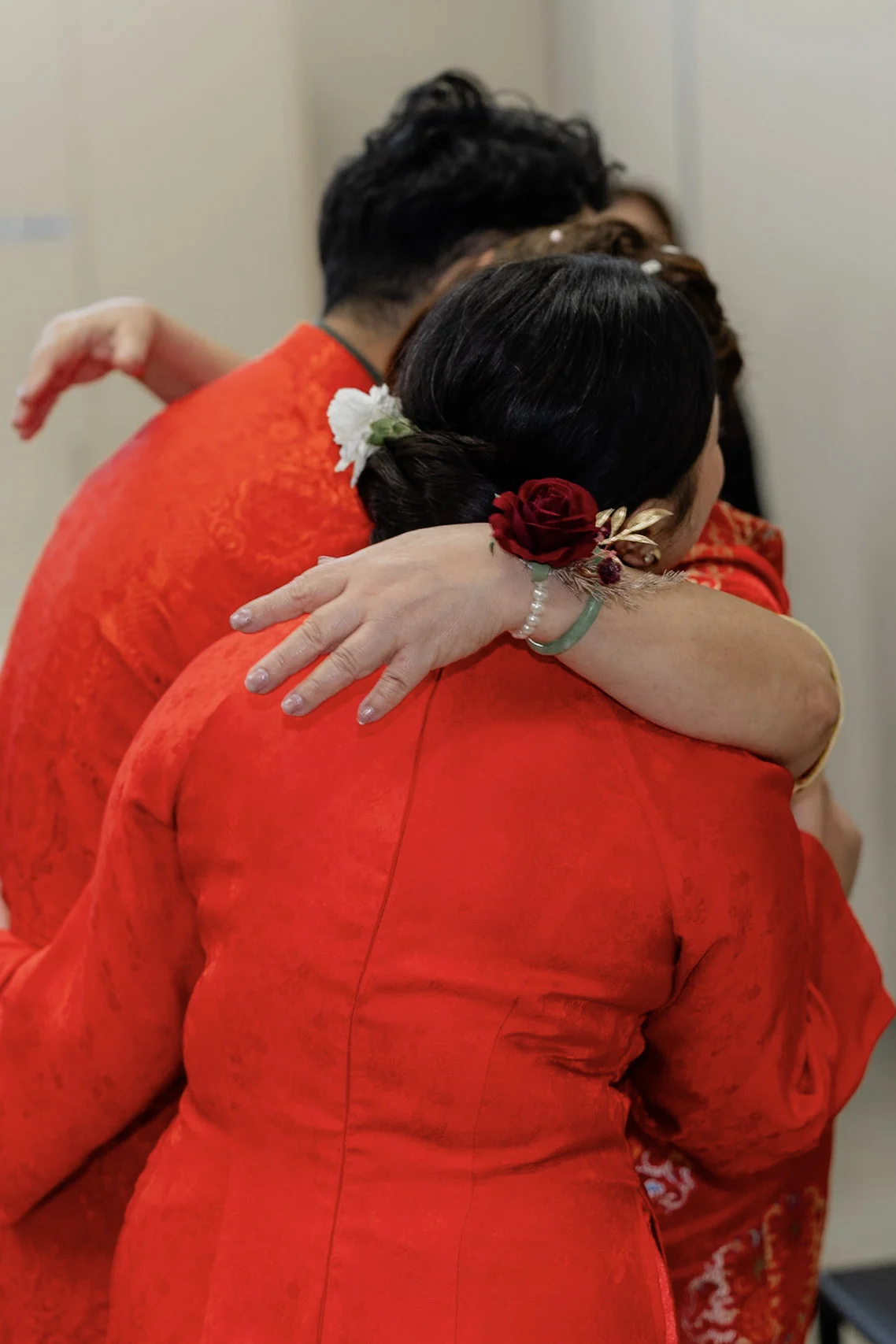 Joy sharing a close embrace with a family elder