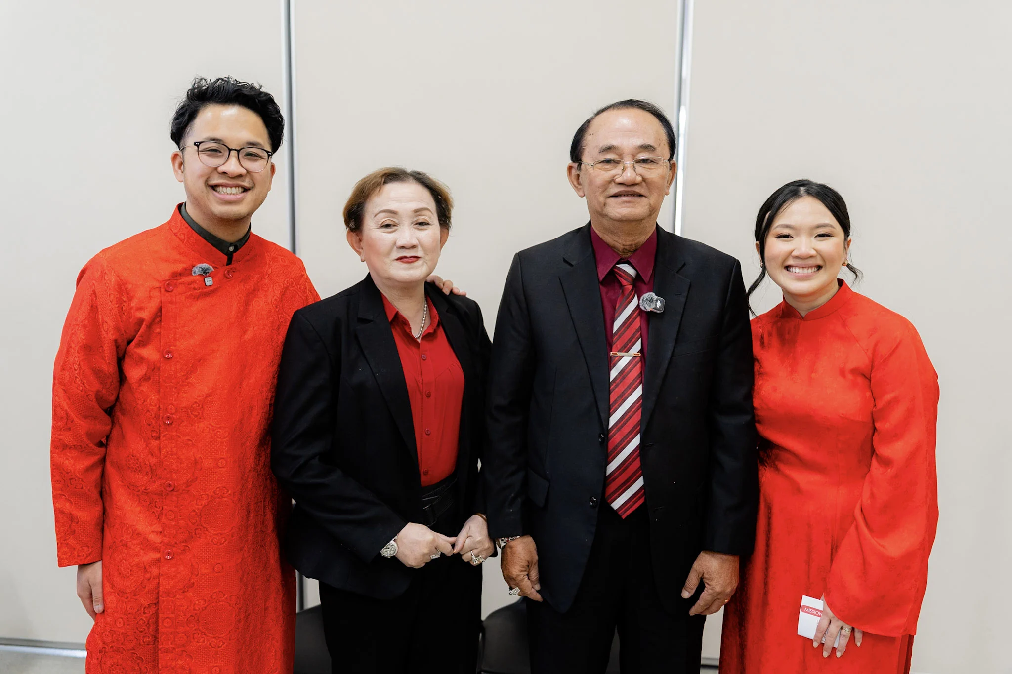 Ron and Joy in red with family after the tea ceremony