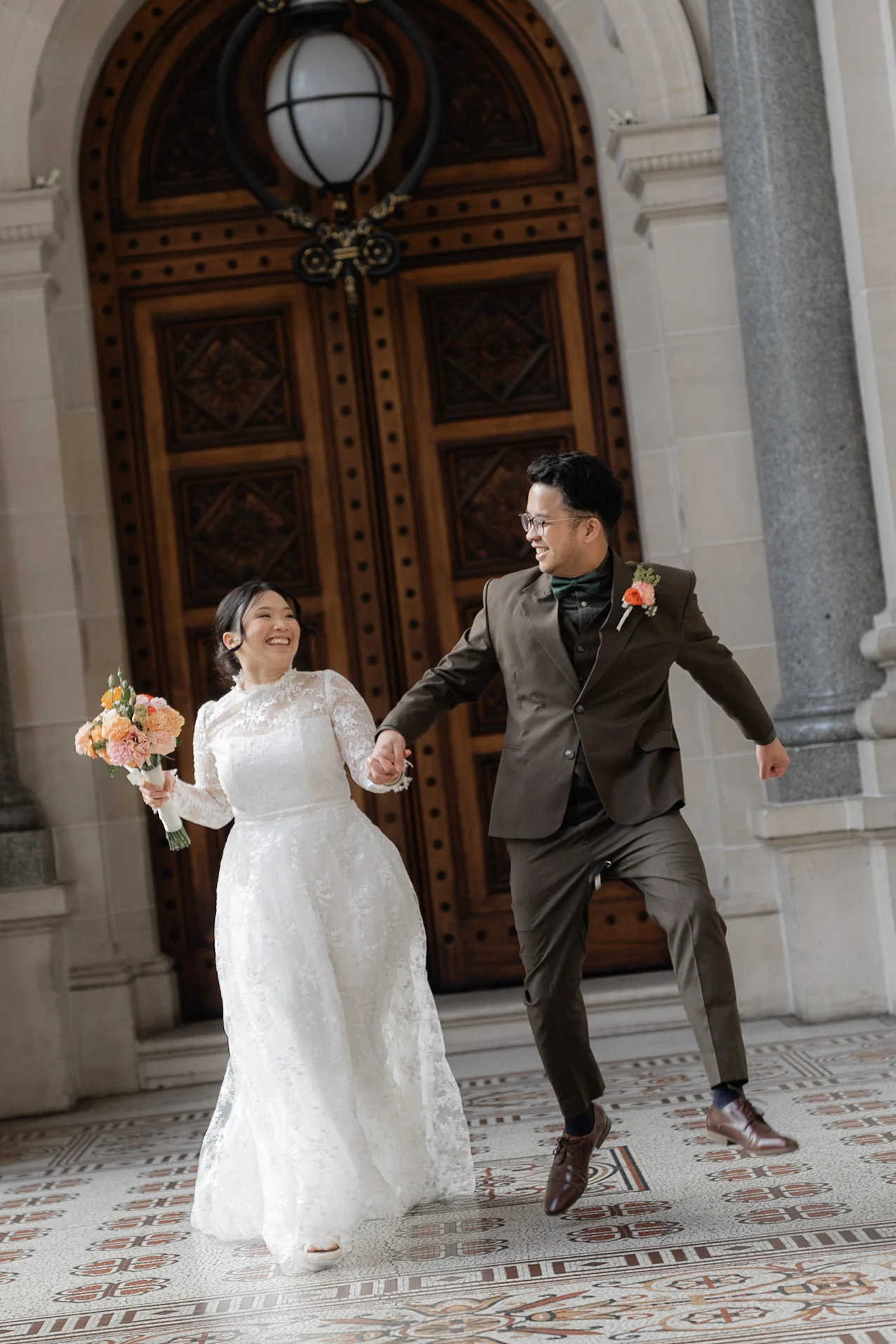 Ron and Joy running hand in hand during their Melbourne portraits