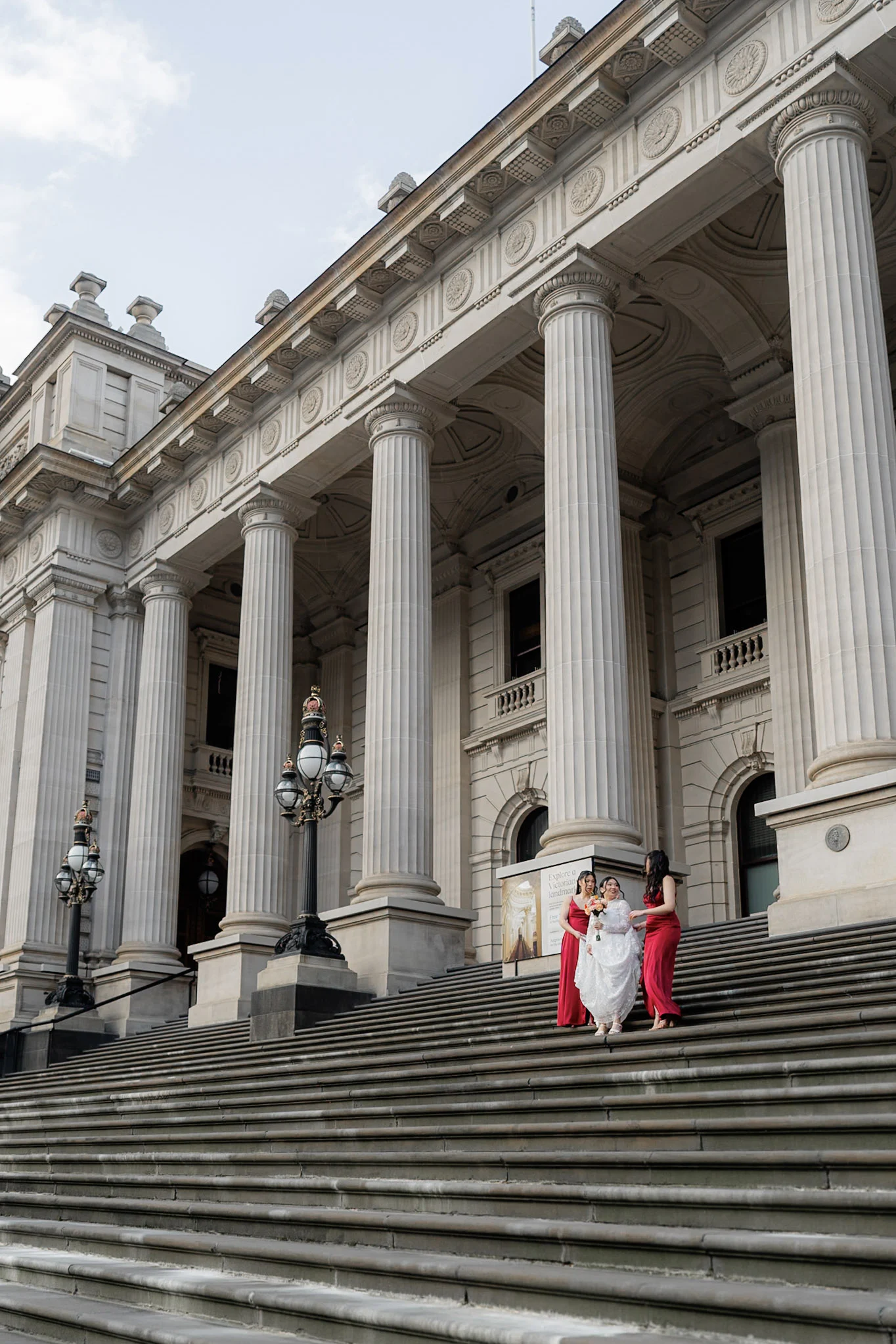 The wedding party arranged on grand Melbourne steps