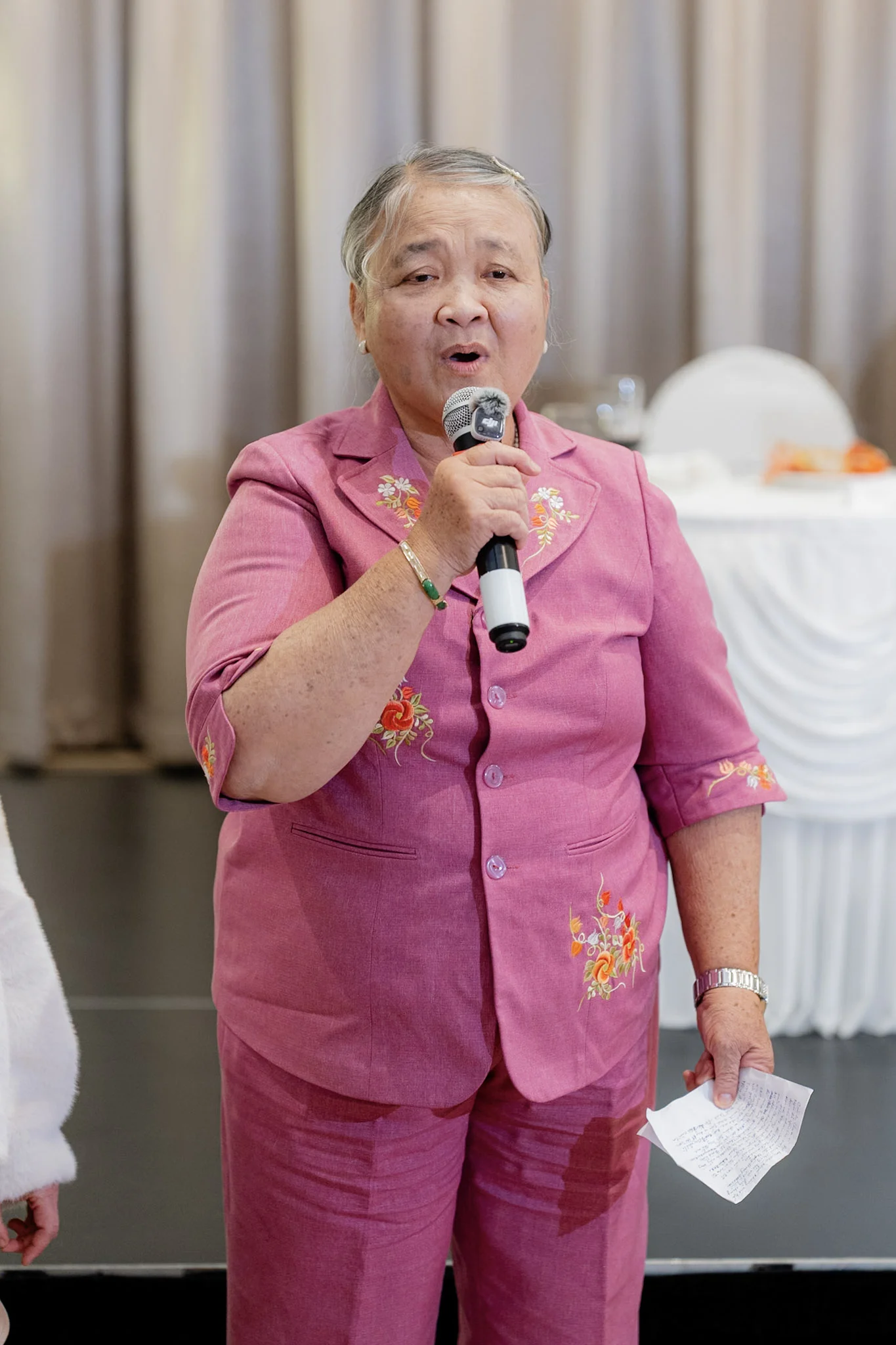 A family member smiling during her reception speech