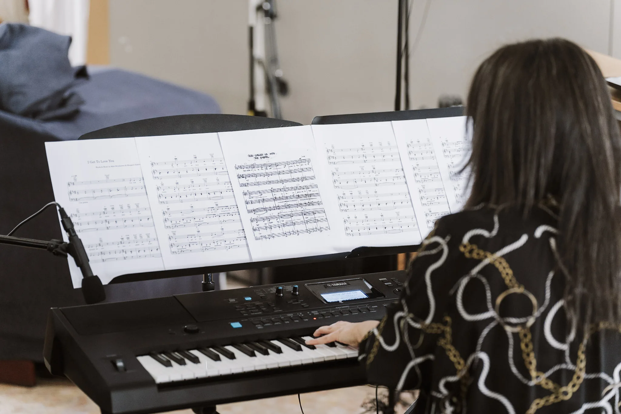 A musician playing the keyboard during the church ceremony