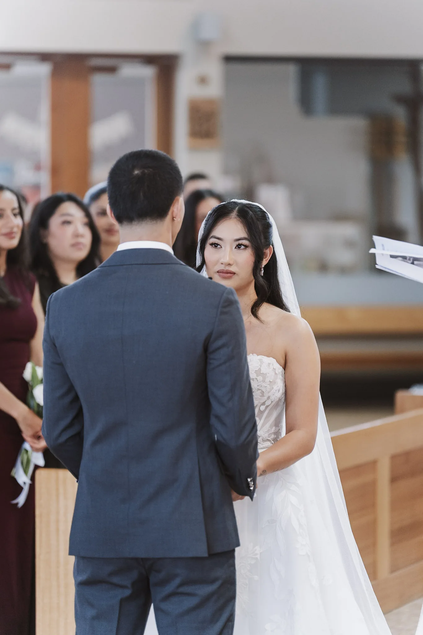 Tee looking at Kevin as they stand together for their vows
