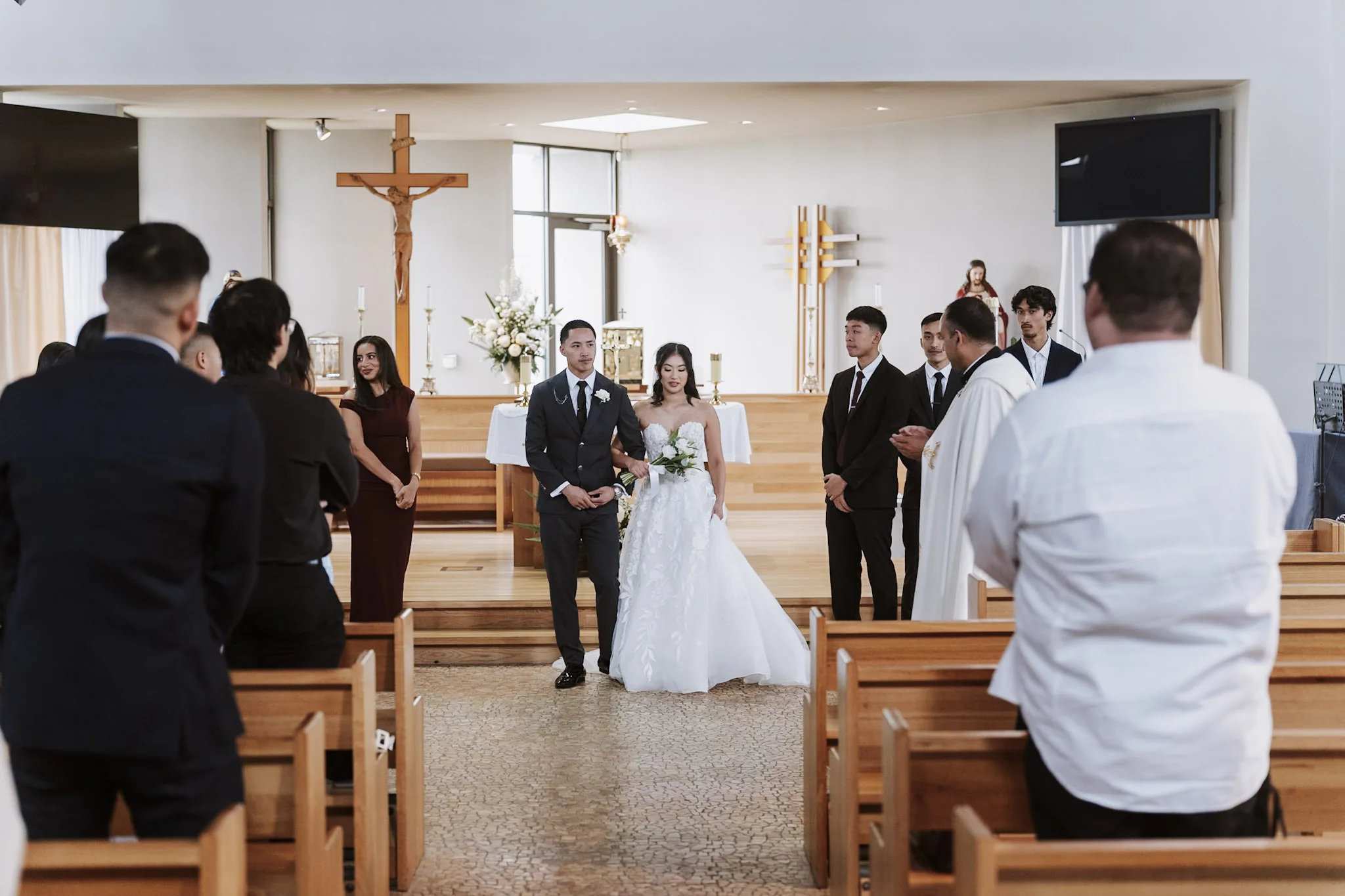 Kevin and Tee walking back along the aisle together