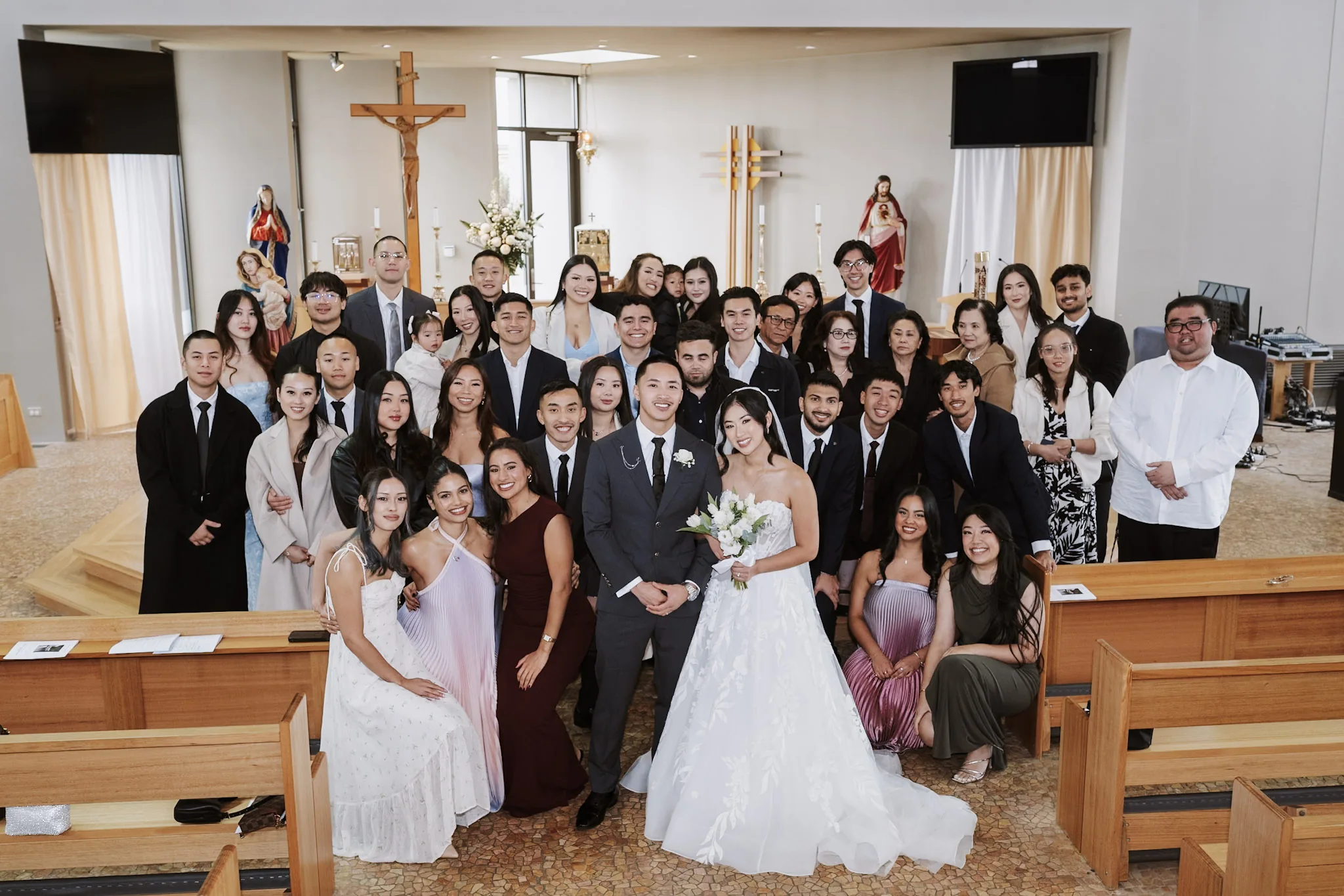 Kevin and Tee with their family and friends gathered in the church