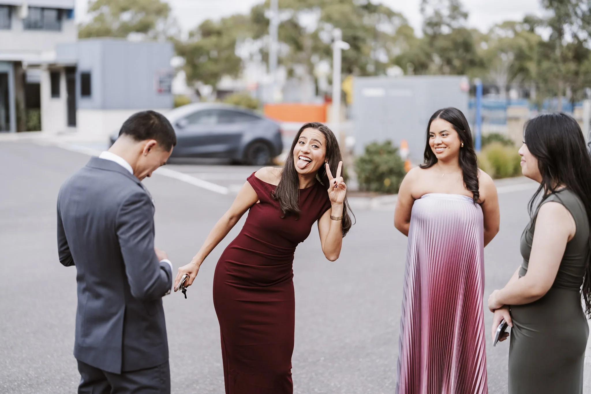 Friends laughing together between the group photographs